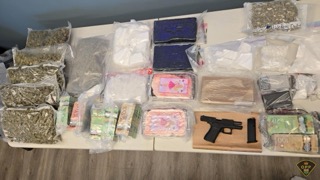 Bundles of cash and packages on a table.