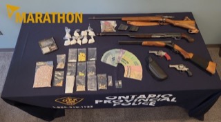 Drugs and firearms seized.