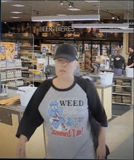 Person wearing a baseball cap and t-shirt with a cartoon image and the words "WEED Slammed I am!"