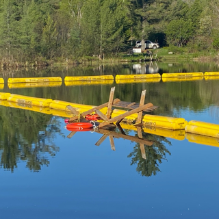 Yellow floating docks on a calm lake.