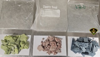 Three bags of shredded material on white paper.