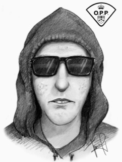 Black and white portrait of a person wearing a hooded sweatshirt and sunglasses.