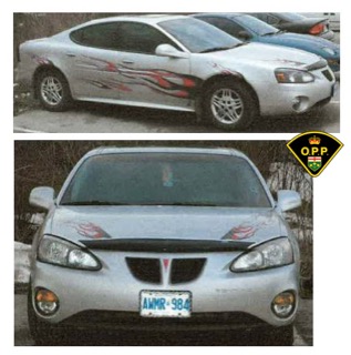 White sedan with red graphic details.