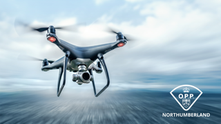 Drone in flight, blurred background