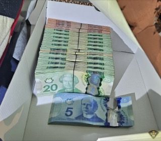 Stacks of Canadian twenty and five dollar bills