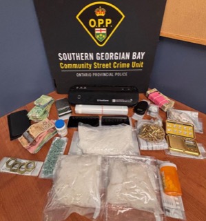 Canadian currency, bundles of cash, packages of drugs, gold bars, pills, and a money counter