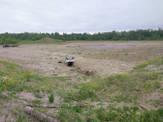 Wrecked car in a field