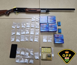 Shotgun, baggies of white powder, shotgun shells, wallet, phone