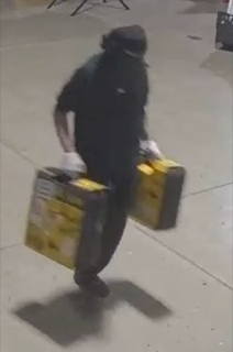 Person carrying two boxes.
