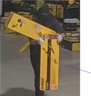 Person carrying three yellow boxes.