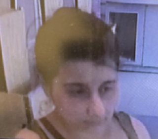 Close-up of a person with short dark hair