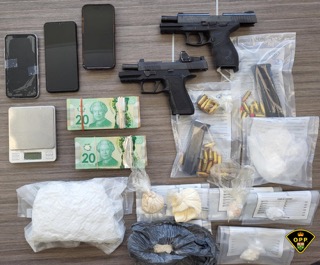 Firearm, drugs, cash, and a scale