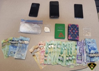 Stacks of Canadian currency and small packages.