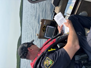 Ontario Provincial Police officer examining a document