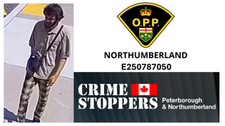 Man wearing a white hoodie and dark pants.