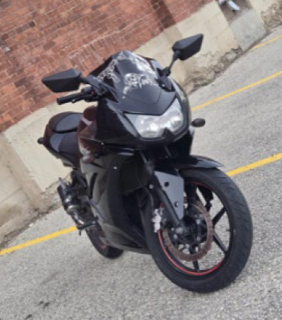 Black sport motorcycle with silver dragon graphic