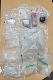 Pile of various shipping labels and packaging.