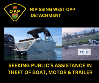 White boat on a trailer, Ontario license plate Y99 30Z