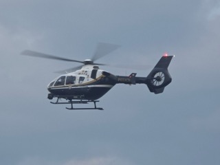 Black and white helicopter in flight