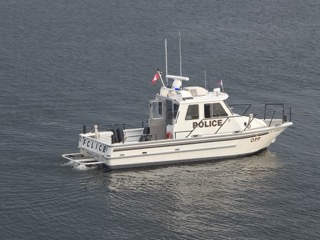 Police boat on water.