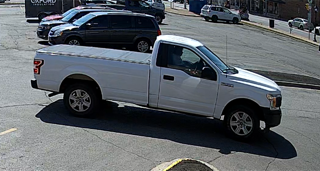 White pickup truck parked on a street