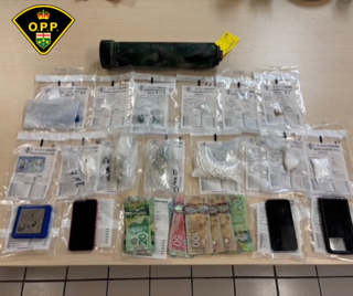 Small baggies and cash on a surface