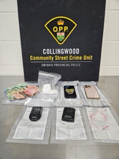 Ontario Provincial Police logo, Community Street Crime Unit, and Ontario Provincial Police text. Stack of Canadian twenty-dollar bills, digital scale, two cell phones, and several plastic baggies on a gray surface.