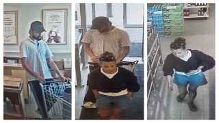 Three people in a store.