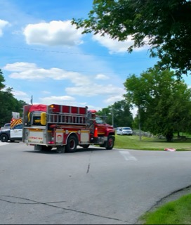 Red fire truck on a street.
