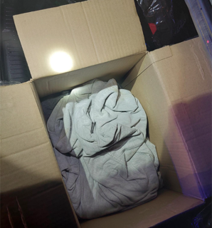 Gray fabric inside a cardboard box