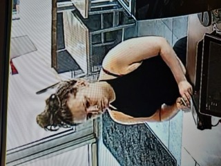 Person kneeling, head down.