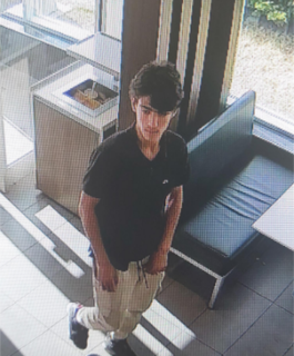 Person standing with arms crossed