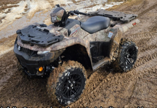 All-terrain vehicle covered in mud