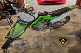 Dirt bike covered in mud.