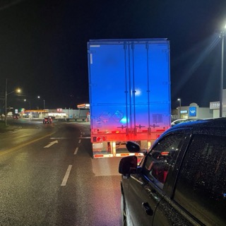 Blue and red flashing lights on a truck trailer
