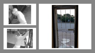 Man boxing Exterior of building through a barred window