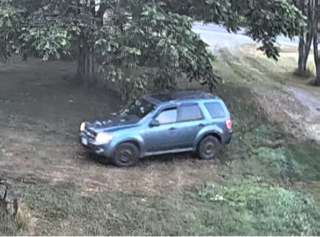 Blue Ford Escape off-road