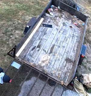 Dump trailer with debris.