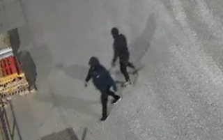 Two people skateboarding.