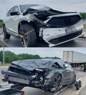 Damaged gray sedan on a tow truck.