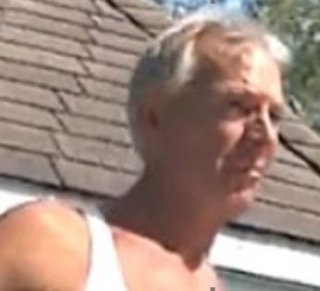 Man with short blond hair, white tank top