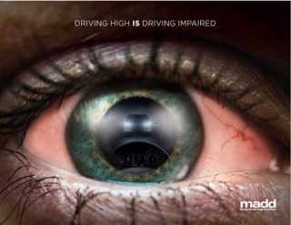 Close-up of an eye with a car dashboard reflected in the pupil. Driving high is driving impaired. Madd.