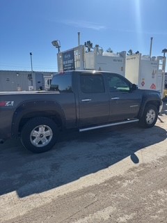 Gray pickup truck parked on asphalt