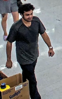 Man in black t-shirt and dark pants