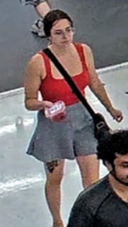 Person in red tank top and gray shorts