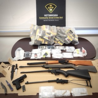 Firearms and drugs seized by police.