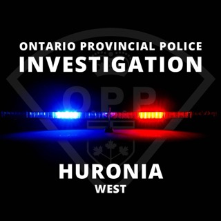 Ontario Provincial Police logo over flashing blue and red lights