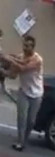 Person in white shirt and gray pants dancing
