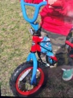 Blue and red bicycle with black tires