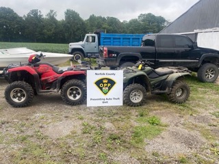 Two red and black all-terrain vehicles. Norfolk County OPP Preventing Auto Theft Unit.
